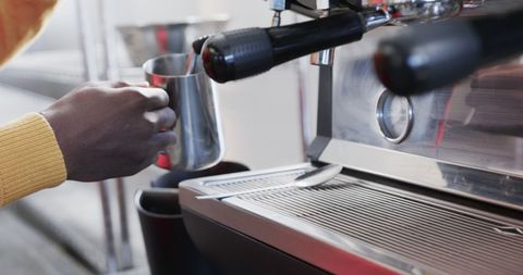Barista Making Coffee in Modern Cafe