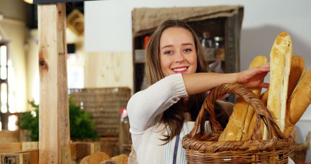 Smiling Baker Handling Fresh Bread in Artisan Bakery - Download Free Stock Images Pikwizard.com