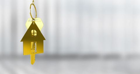 Golden house keychain symbol of real estate success