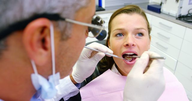 Dentist Examining Young Woman's Teeth in Clinic - Download Free Stock Images Pikwizard.com