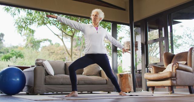 Senior biracial woman practicing yoga, stretching - Download Free Stock Photos Pikwizard.com