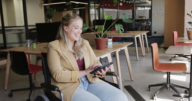 Smiling Woman in Wheelchair Using Tablet at Modern Office - Download Free Stock Images Pikwizard.com