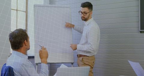 Professional Sharing Ideas with Flip Chart in Modern Conference Room