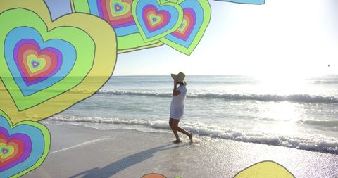 Dreamy Beach Scene with Colorful Floating Hearts Overlay