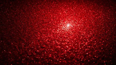 Crimson sequin sparkle with starburst highlight, macro glitter texture for festive design