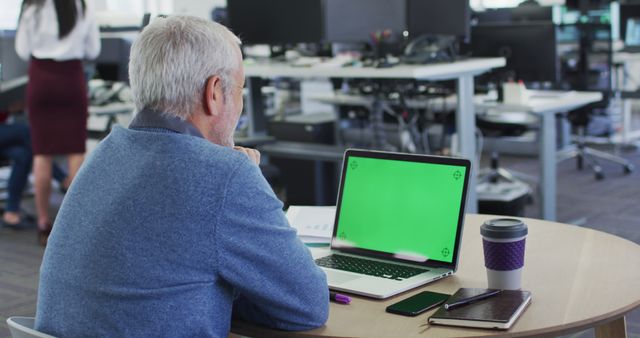 Senior Man Working on Laptop with Green Screen in Modern Office - Download Free Stock Images Pikwizard.com