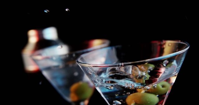Close-up of Martini Glasses with Olives and Drop Splash - Download Free Stock Photos Pikwizard.com
