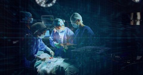 Surgical team performing operation in high-tech operating room with sterile instruments