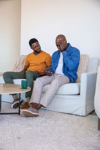Father and Son Sharing Moment During Casual Home Bonding