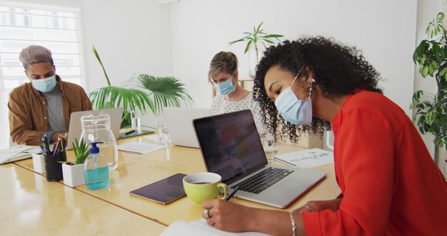 Diverse Colleagues Working in Office with Face Masks - Download Free Stock Images Pikwizard.com