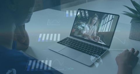 Remote team collaborating over laptop video call with data overlays and modern workspace