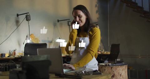 Creative Artisan Engaging Clients Online From Industrial Workshop