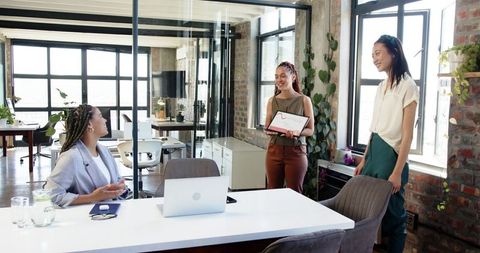 Colleagues Celebrating Success with Reward Recognition in Modern Office