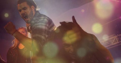 Dynamic lead vocalist electrifying performance on stage