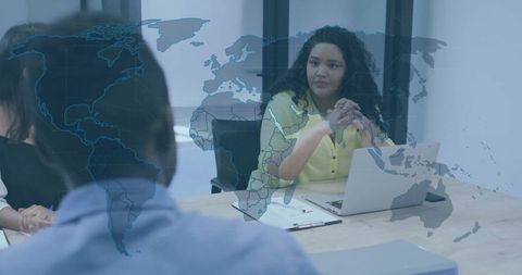 Businesswoman Leading Team Meeting in Modern Office Setting