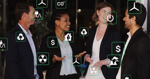 Business Professionals Discussing Sustainability Initiatives in Modern Office