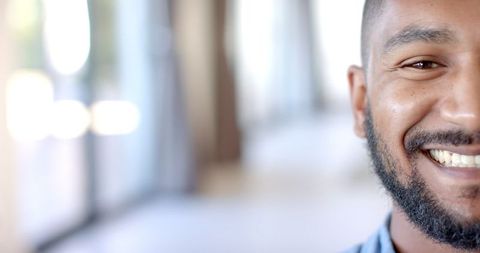 Cheerful Young Man Smiling Brightly in Sunny Ambiance - Download Free Stock Images Pikwizard.com