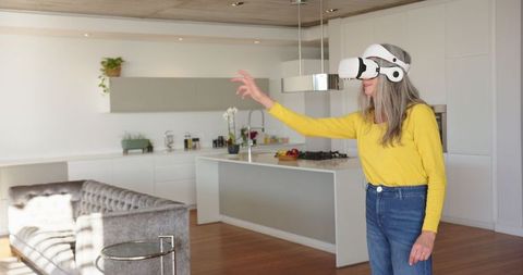 Senior Woman Engaging with VR Technology in Modern Living Room