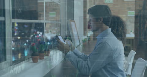 Business Professionals Analyzing Financial Data on Devices