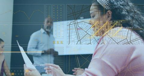 Woman analyzing data on transparent technology in office