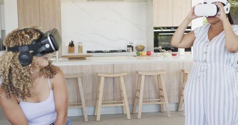 Young Women Enjoying Virtual Reality Experience at Home
