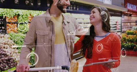 Smiling couple shopping in produce aisle with tablet and augmented reality data overlays