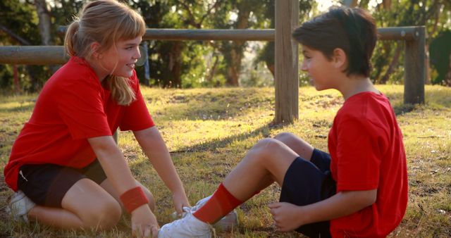 Girl Helping Injured Boy During Outdoor Activity - Download Free Stock Images Pikwizard.com