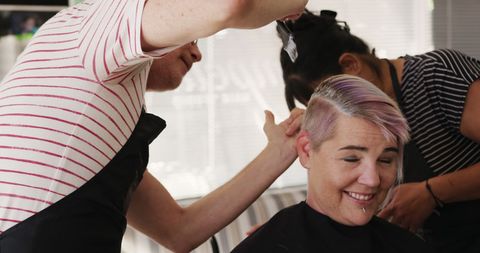 Smiling Client with Hairstylists Dyeing Hair in Salon - Download Free Stock Images Pikwizard.com