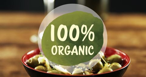 100 Percent Organic Label Over Green Olives in Bowl - Download Free Stock Images Pikwizard.com