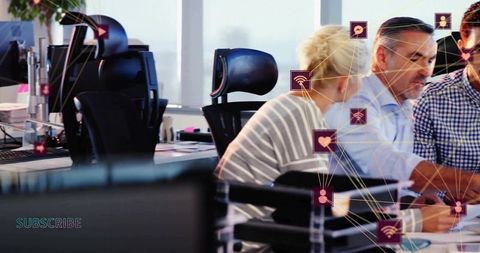 Team Collaborating at Open-Plan Office Desk with Social Network Overlay and Monitors
