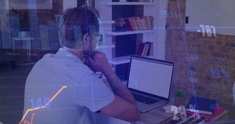 Entrepreneur analyzing financial trends in home office