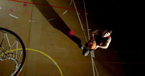 Basketball Player Ready to Take a Shot on Indoor Court