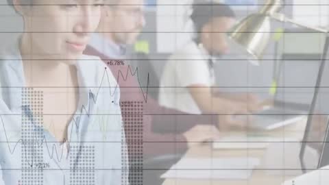 Team Collaborating on Laptops with Financial Graph Overlays