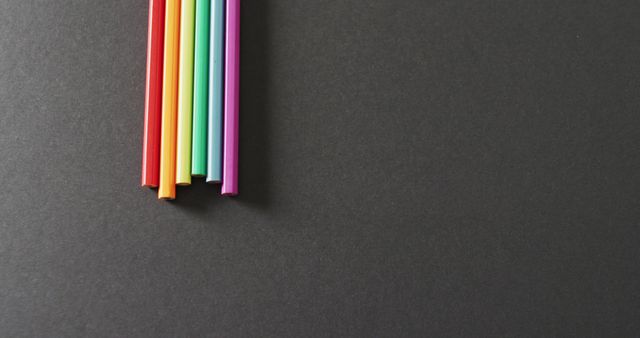 Image of rainbow straws over grey background with copy space - Download Free Stock Photos Pikwizard.com