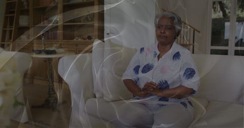 Worried African Senior Woman Reflecting on Mental Well-being at Home
