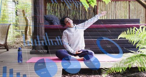 Woman Practicing Yoga Outdoors with Digital Data Overlay