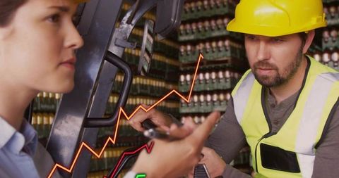 Warehouse Workers Analyzing Inventory Data for Efficiency