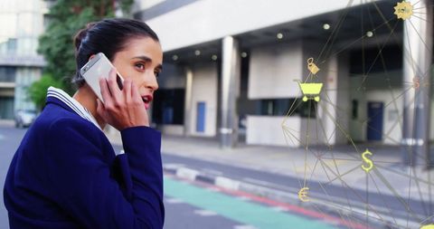 Businesswoman Engaging in Phone Call with Digital Finance Interface
