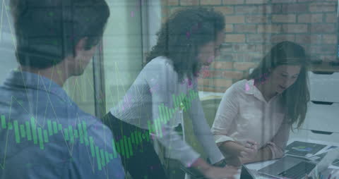 Diverse Business Team Analyzing Data in Modern Office Setting