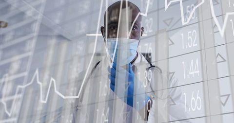 Doctor Standing Behind Transparent Data Display in Medical Clinic