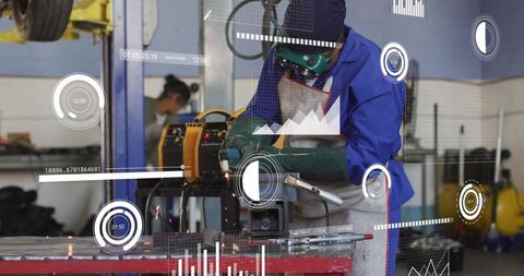 Technician grinding clamped metal with hud analytics overlay in industrial workshop