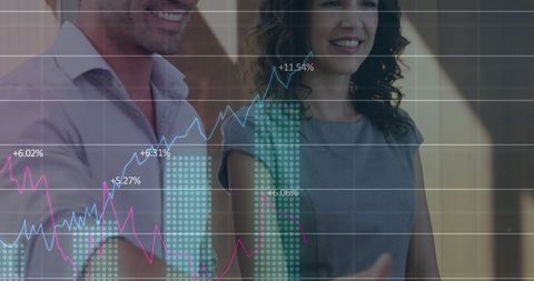 Caucasian Couple Receives Keys Overlayed with Financial Charts