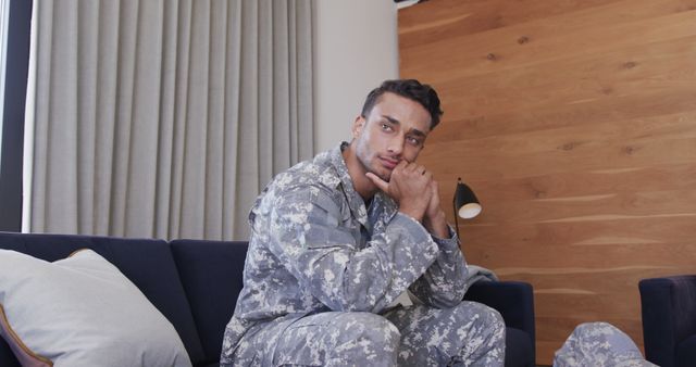 Thoughtful Military Soldier Resting on Sofa at Home - Download Free Stock Images Pikwizard.com