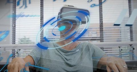 Senior woman experiencing virtual reality headset with futuristic blue hud overlay in lounge
