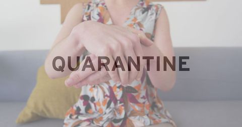 Woman sanitizing hands front view indoors