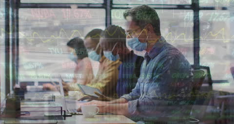 Diverse Professionals Working in Office with Stock Market Overlay