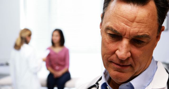 Concerned Male Doctor During Patient Consultation - Download Free Stock Images Pikwizard.com