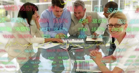 Diverse Team Analyzing Stock Market Trends in Modern Office Meeting