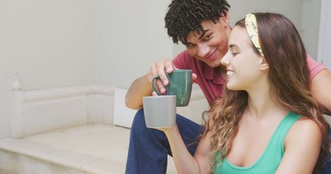 Cheerful Couple Enjoying Coffee Together at Home