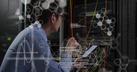 Tech Professional Monitoring Data in High-Tech Server Room - Download Free Stock Images Pikwizard.com